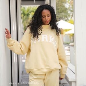 Soft Yellow Sweatshirt with White Lettering